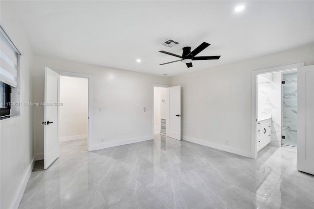 unfurnished bedroom featuring ensuite bathroom and ceiling fan