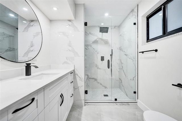 bathroom featuring vanity, an enclosed shower, and toilet