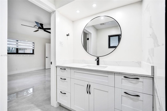 bathroom with ceiling fan and vanity