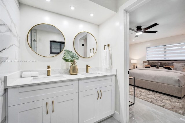 bathroom with ceiling fan and vanity