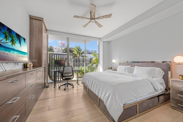 bedroom featuring expansive windows, access to exterior, ceiling fan, and light hardwood / wood-style floors