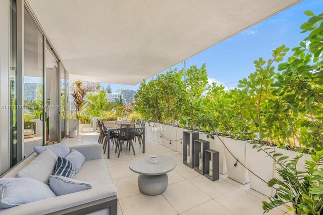 view of patio with a balcony and outdoor lounge area