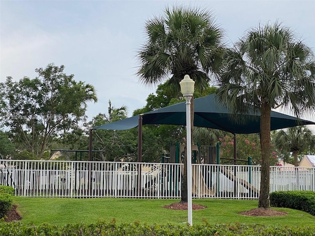 exterior space featuring a playground and a lawn