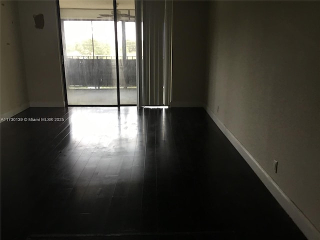 unfurnished room featuring hardwood / wood-style floors