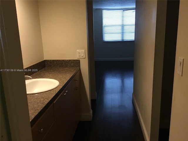 bathroom featuring hardwood / wood-style floors and vanity