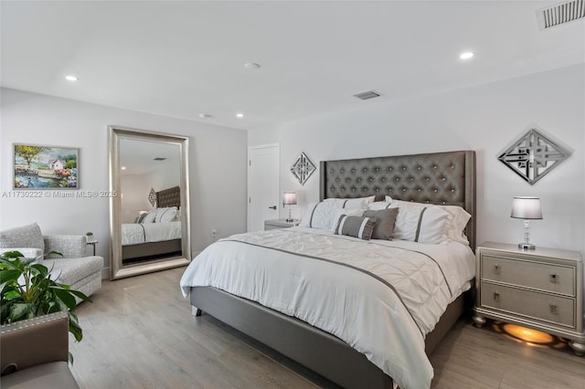 bedroom with light wood-type flooring