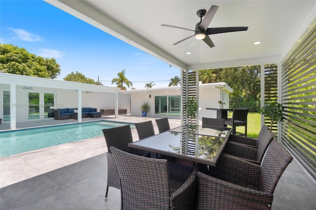 view of pool featuring a patio, an outdoor hangout area, and ceiling fan