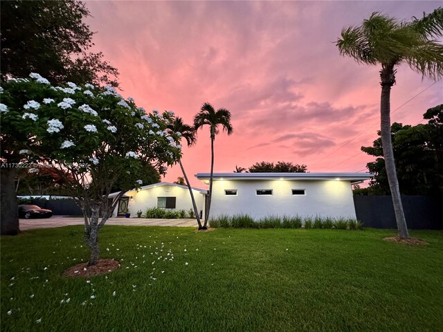 view of front of property with a yard