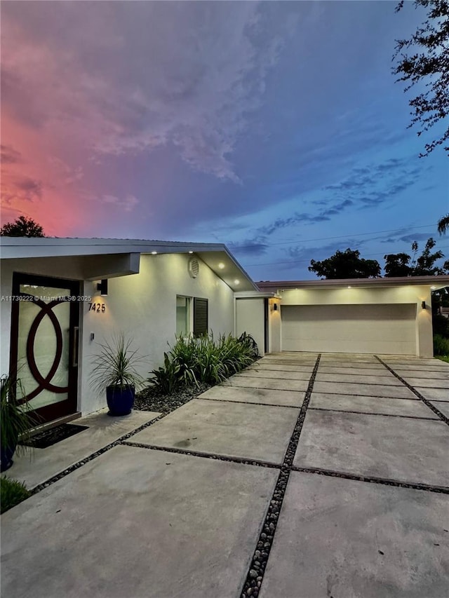 view of front of property with a garage