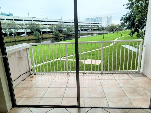 balcony featuring a water view