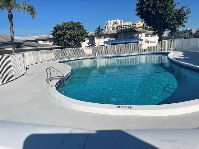 community pool featuring fence