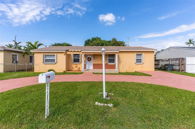 ranch-style house with a front lawn