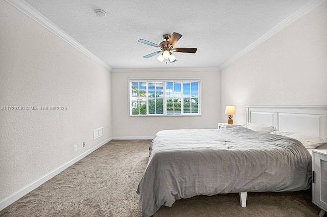 carpeted bedroom with ceiling fan, ornamental molding, and a textured ceiling