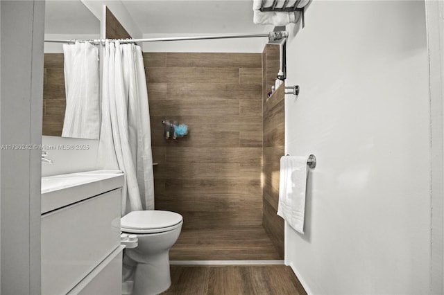 bathroom with vanity, hardwood / wood-style flooring, toilet, and a shower with curtain