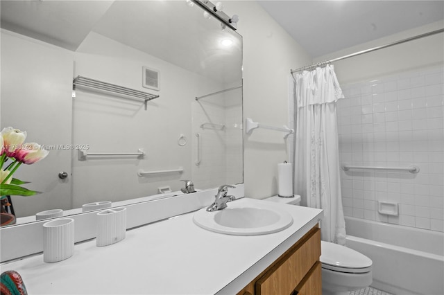 full bathroom featuring shower / bath combo with shower curtain, toilet, and vanity