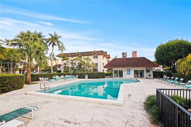 view of swimming pool with a patio area