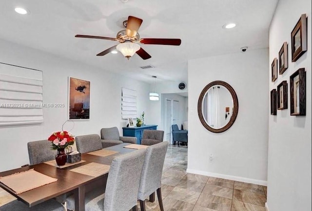 dining space featuring ceiling fan