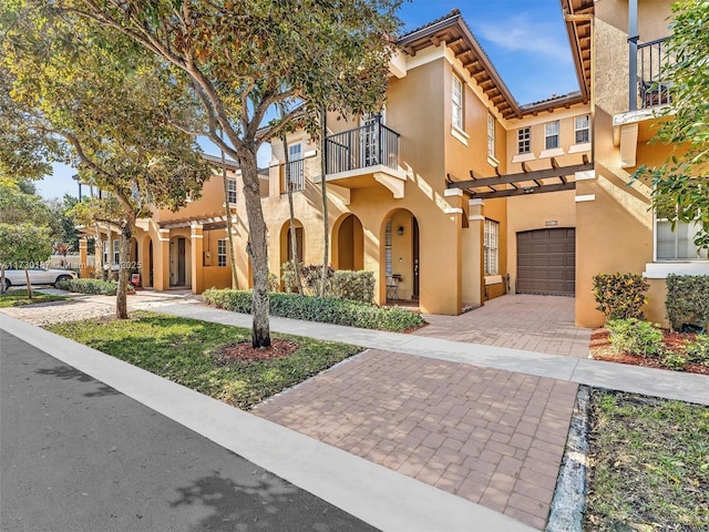 mediterranean / spanish-style home featuring a garage