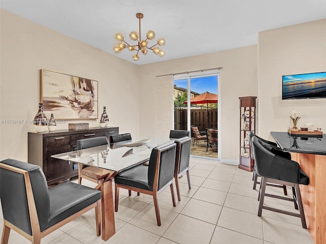 dining space with an inviting chandelier and light tile patterned floors