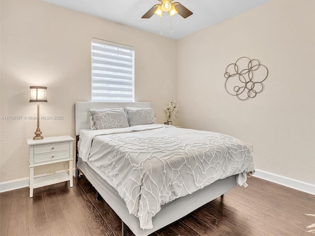 bedroom with hardwood / wood-style flooring and ceiling fan