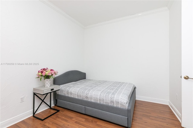 bedroom with hardwood / wood-style flooring and ornamental molding