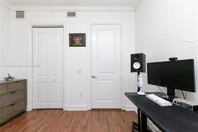 office space featuring crown molding and dark wood-type flooring