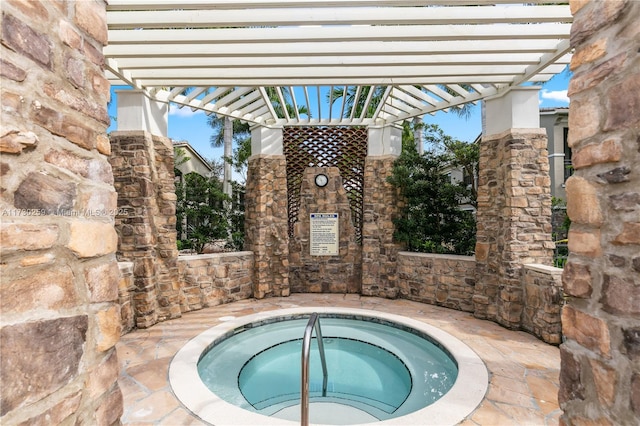 view of swimming pool with a pergola and a hot tub