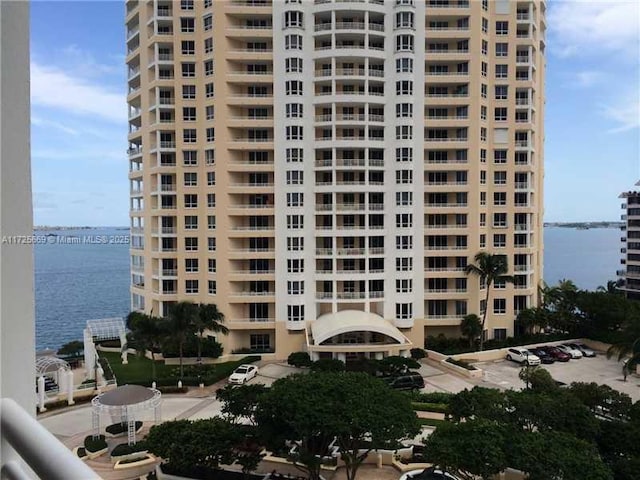 view of building exterior with a water view