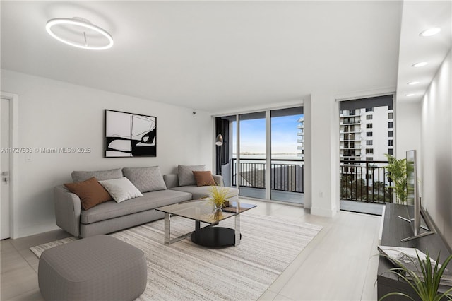 living room featuring a wall of windows