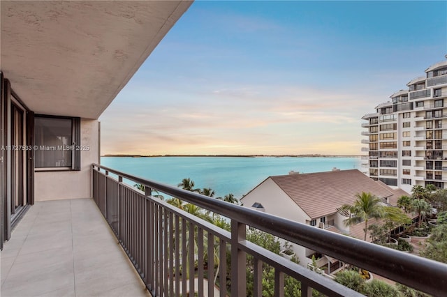 balcony at dusk with a water view