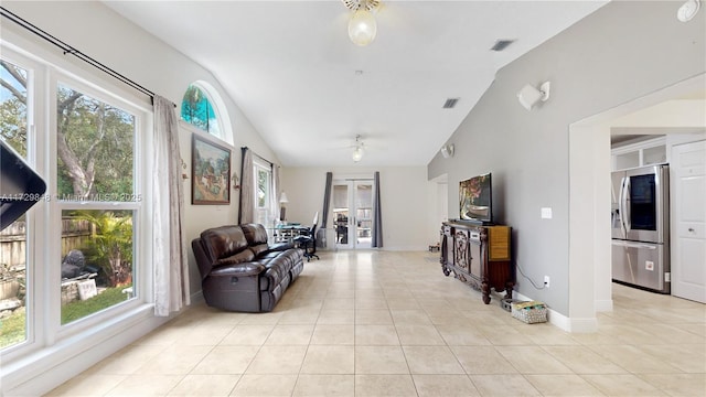 tiled living room featuring lofted ceiling