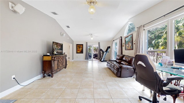 office with light tile patterned floors, a wealth of natural light, and vaulted ceiling