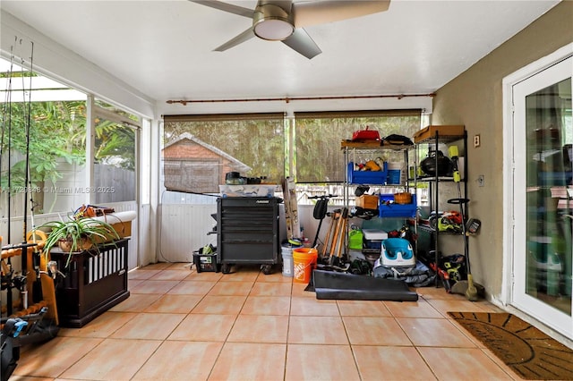 sunroom with ceiling fan