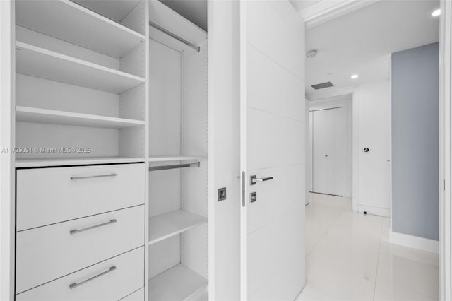 walk in closet featuring light tile patterned floors