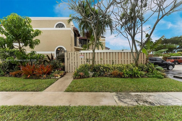 view of side of home featuring a yard