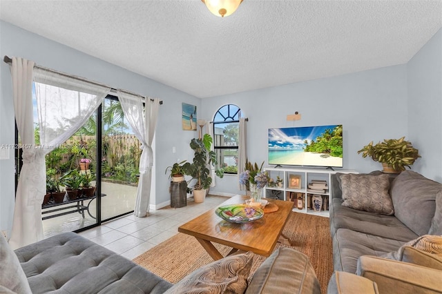 tiled living room featuring a textured ceiling