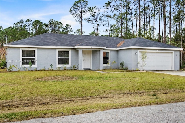 ranch-style home with a garage and a front lawn