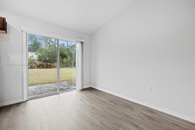 spare room with light hardwood / wood-style floors