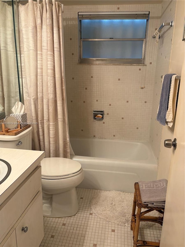 full bathroom featuring shower / bath combination with curtain, vanity, toilet, and tile patterned flooring