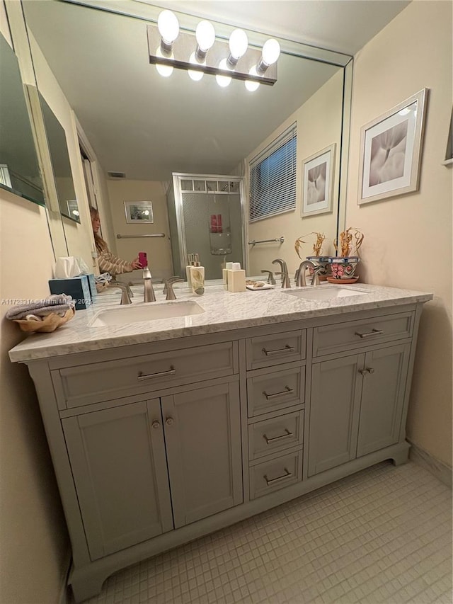 bathroom with vanity and an enclosed shower