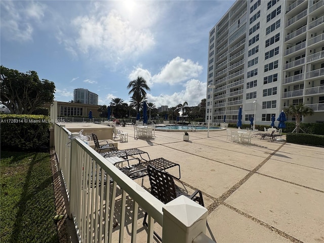 view of home's community featuring a swimming pool and a patio area