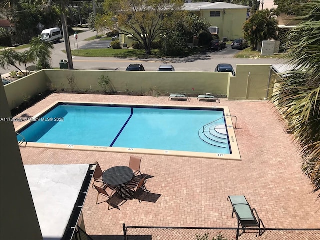 view of pool featuring a patio