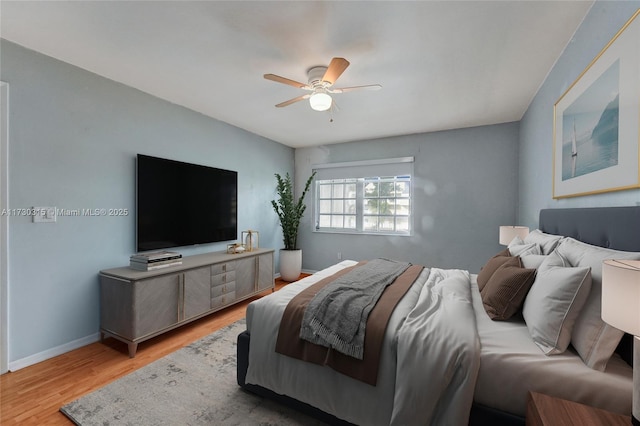 bedroom featuring light hardwood / wood-style flooring and ceiling fan