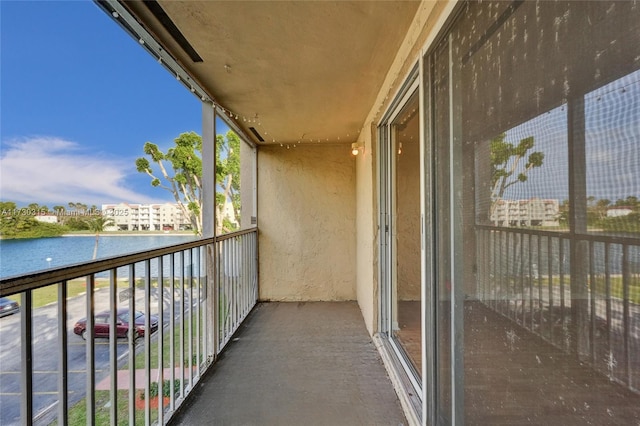 balcony featuring a water view