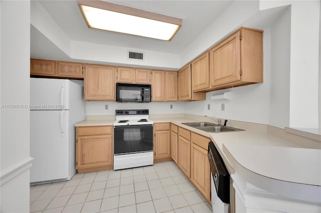 kitchen featuring white appliances, light tile patterned floors, visible vents, light countertops, and a sink