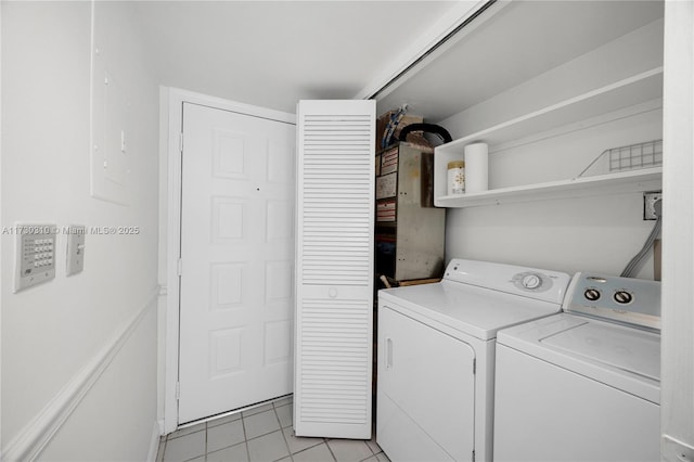 washroom featuring laundry area, light tile patterned floors, and independent washer and dryer