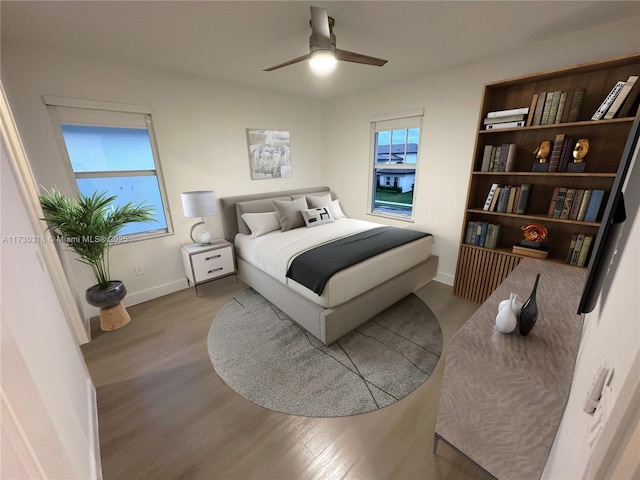 bedroom featuring ceiling fan and light hardwood / wood-style flooring