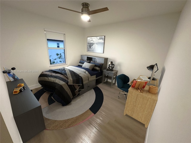 bedroom with ceiling fan and light wood-type flooring