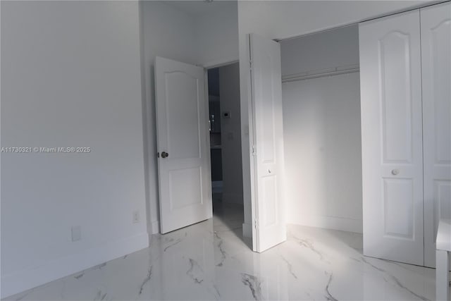 unfurnished bedroom with a closet