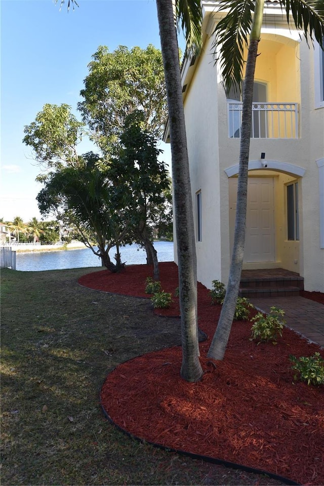 exterior space with a water view